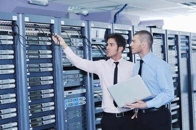 group of young business people it engineer in network server room solving problems and give help and support